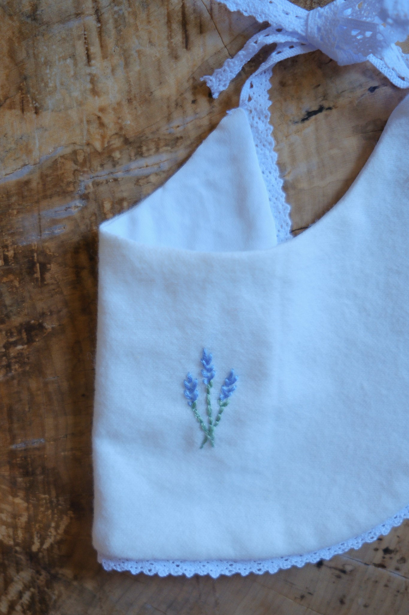 White Cotton Bib with Blue Embroidered Flowers