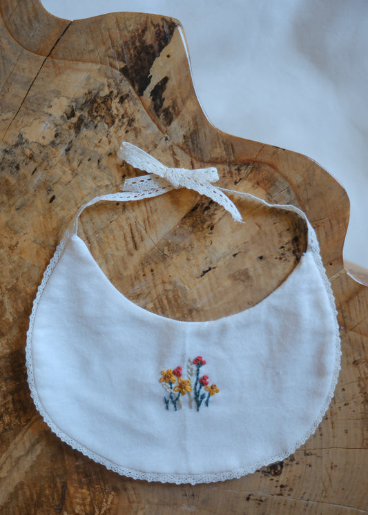 White Bib with Embroidered Wildflowers