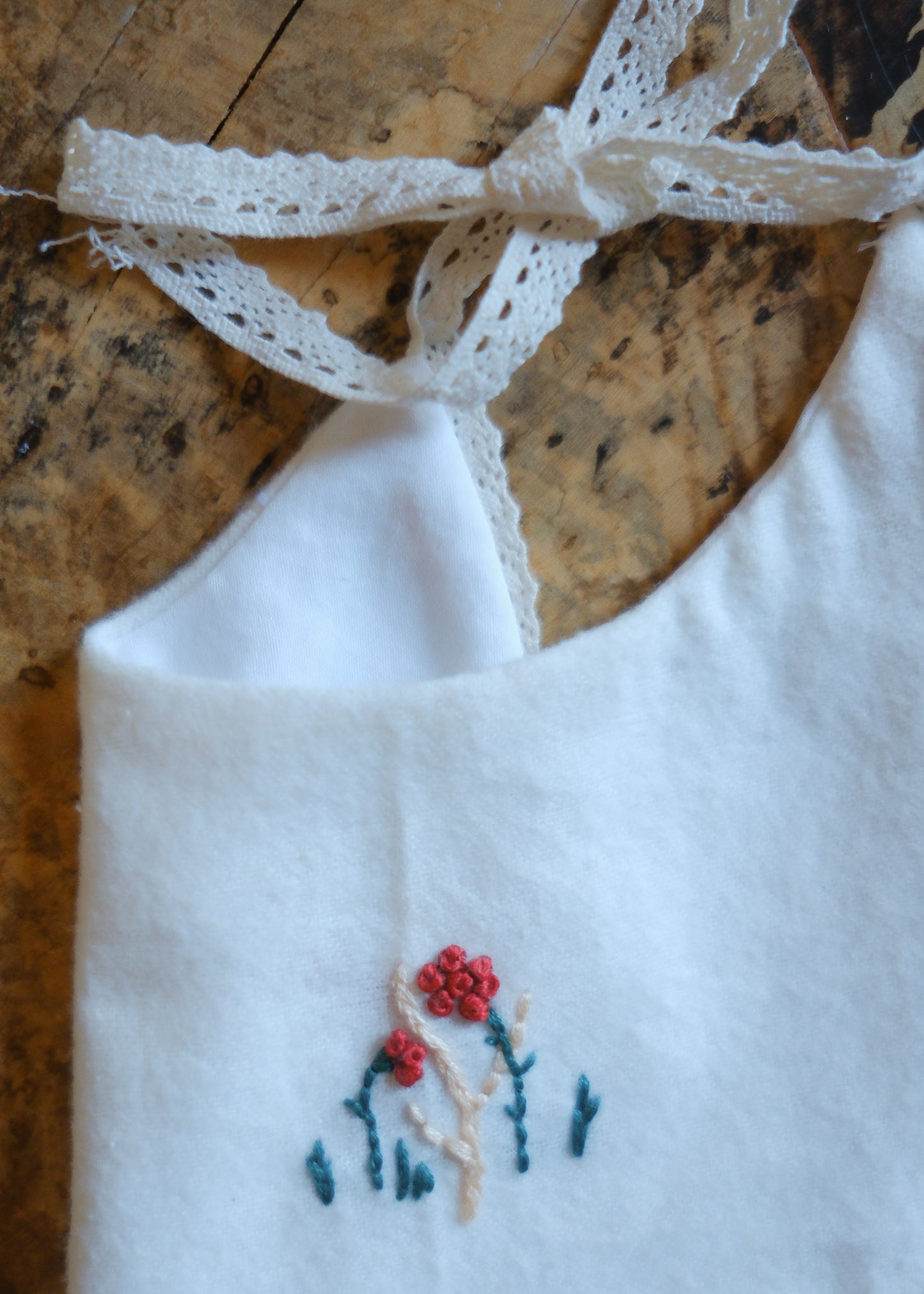 White Cotton Bib with Red Embroidered Flowers